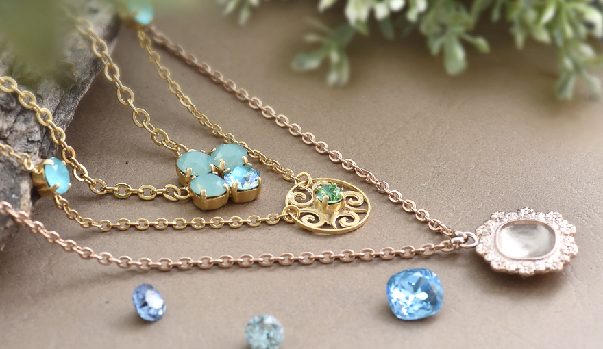 Necklaces made with gold pendants & SW crystals
