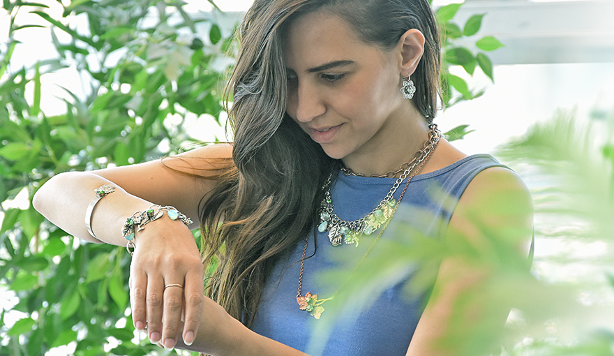 Green nature themed jewelry with plenty of charms 